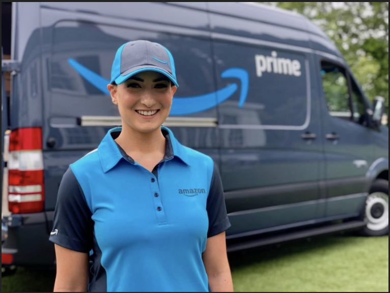Female Amazon Driver standing by Amazon Prime Truck Amazon lawsuit stealing tips 